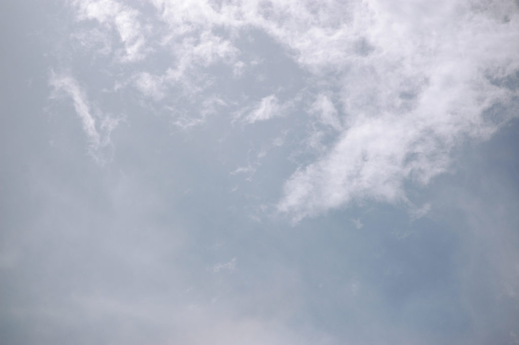 a blue sky with wispy white clouds - link opens photo in full resolution